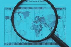 a magnifying glass is sitting on top of a world time zone map with the words world time zones below it