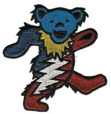 a blue teddy bear with lightning bolt on it's chest running through the air