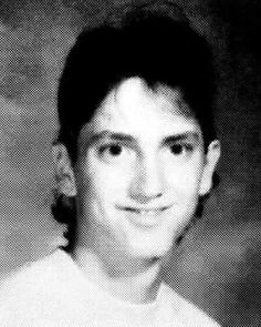 black and white photograph of a young man smiling