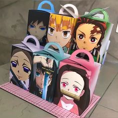 an image of anime characters on display in front of a computer screen or tabletop