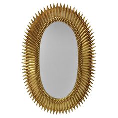 a mirror that is gold in color on a white background with the reflection of it's sunburst