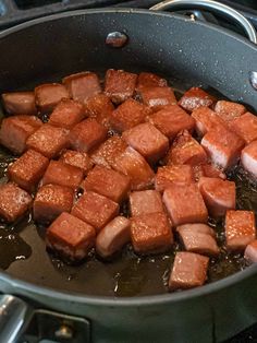 the food is being cooked in the pan on the stove