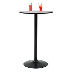 two drinks are sitting on top of a black round table with a white base and one has a red drink in it