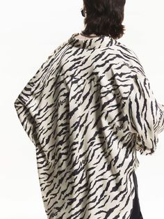 MO&Co. Women's Loose Tiger Print Shirt Made from lightweight fabric for breathability. This loose-fit design allows for maximum comfort and ease of movement, making it perfect for any casual occasion. The eye-catching tiger print adds a bold and playful touch to your outfit. Features : - Loose shirt-style blouse- Curved hem with slit detail, chest pocket- Tiger print design Code: MBD3SHT023The back length of size S is 76cmMATERIALS & CARE Material: 100% ViscoseREMINDER: All items are measured ma Tiger Clothes, Tiger Print Shirt, Casual Summer T-shirt With Tiger Print, Tiger Print Jacket, Casual Cotton T-shirt With Tiger Print, Casual Tiger Print Short Sleeve T-shirt, Loose Shirt