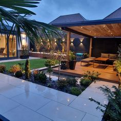 an outdoor living area is lit up at night