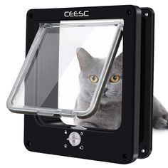 a cat is looking out the window of a black wall mounted pet door that has an image of a grey cat on it