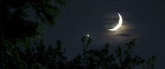 the moon and venus are seen through the clouds