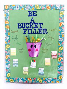 a bulletin board with a purple flower pot on it's side and the words be a bucket filler