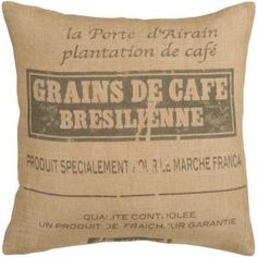 a pillow that is made out of burlock and has the words grains de cafe bresilene on it