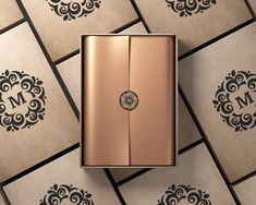 a close up of a light switch in front of many boxes with monograms on them