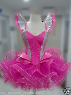 a mannequin dressed in pink and silver