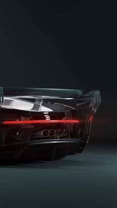 the rear end of a black sports car with red lights on it's taillights