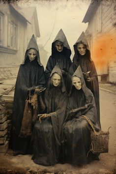 an old photo of three women dressed as witches