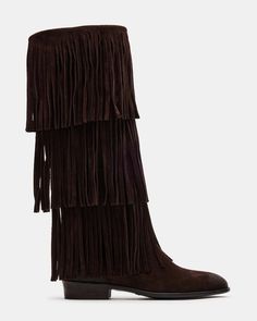 Upgrade your wardrobe with the SPUR fringe boot. These boots feature a fringe detailing that adds a touch of effortless style. Perfect for any occasion, these boots will elevate your look while providing comfort and durability. 1 inch heel height 14.5 inch shaft circumference 15 inch shaft height Suede upper material Synthetic lining Leather sock Synthetic sole Fit tip: If you are in between sizes, size up a half-size Imported Fringe Boots Outfit, Suede Fringe Boots, College Fits, Steve Madden Boots, Leather Socks, Fringe Boots, Suede Fringe, Elevate Your Look, Boots Outfit