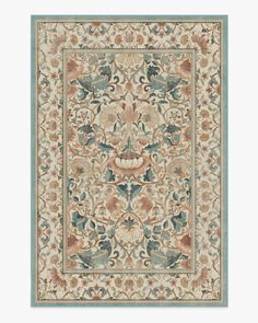 an intricately designed rug with blue, beige and red colors on the bottom corner