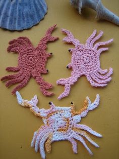 three crocheted sea creatures on a table