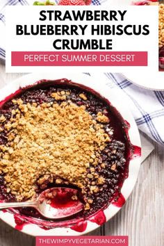 a blueberry crumble dessert in a white bowl with a spoon on the side