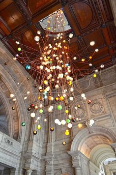 a chandelier hanging from the ceiling in a building