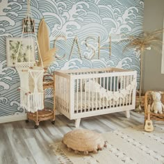 a baby's room decorated in blue and white