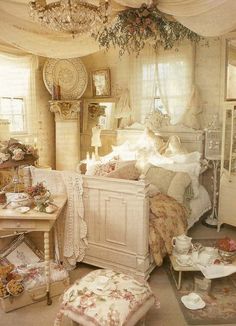 an old fashioned bedroom is decorated in white and pinks, with lots of furniture