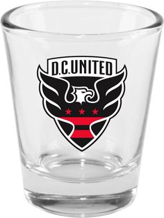 a shot glass with the dc united logo on it