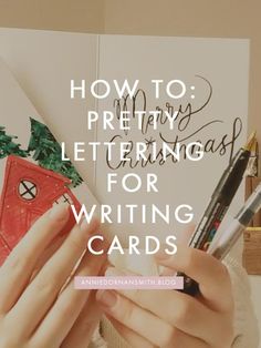 a person writing on paper with the words how to prettiy lettering for writing cards