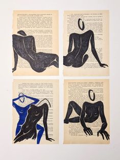 four black and blue drawings on top of an old book