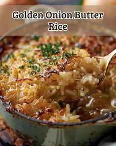 a close up of a spoon in a bowl of rice with onions and parsley