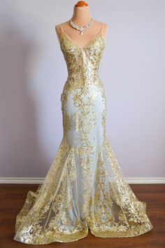 White And Gold Wedding Dress Mermaid, White And Gold Formal Dress, White And Gold Goddess Dress, Long Gold Dress Formal, Gold Mermaid Dress With Sweep Train For Prom, Gold Mermaid Dress For Wedding And Prom Season, Gold Floor-length Mermaid Dress For Prom, Fitted Gold Evening Dress For Homecoming, Gold Mermaid Dress With Sweep Train For Evening