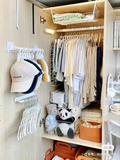 an organized closet with clothes, hats and other items in it's storage area