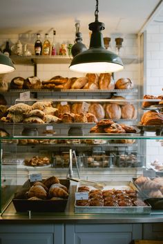 a bakery filled with lots of different types of doughnuts and other pastries