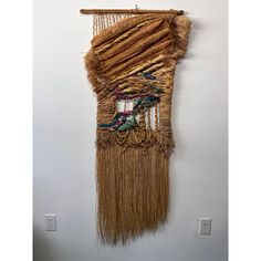 a wall hanging made out of woven material