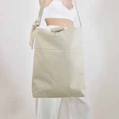 This shoulder bag is crafted from 100% sustainable eco-cotton, in an off-white upcycled denim material. Perfect for everyday use, to hold all of your essentials. Refined Fashion, Upcycled Denim, Denim Collection, Denim Material, Sustainable Fabrics, Shoulder Bags, Reusable Tote Bags, Thread, Off White