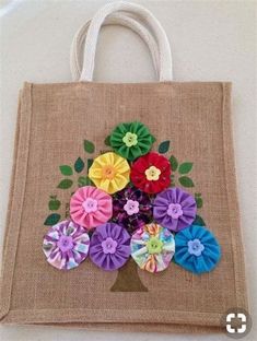 a burlap bag with colorful flowers on it