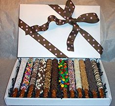 a box filled with lots of different types of candies and pretzel treats