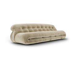 a beige couch sitting on top of a white floor