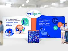 two people are standing in front of a wall with an advertisement for wellgentt