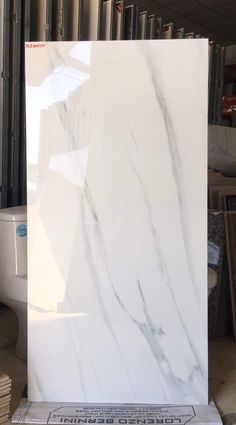 a large white marble slab in a warehouse