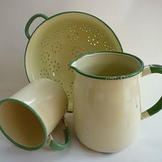 three green and white coffee mugs sitting next to each other