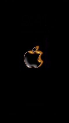 an apple logo is shown in the dark with yellow light coming from it's side