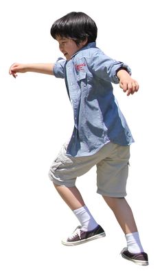 a young boy riding a skateboard on top of a white surface in the air