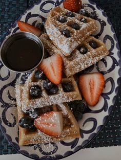 waffles, strawberries and blueberries on a plate