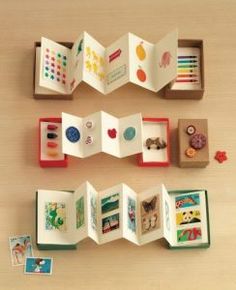 there are many small cards and magnets in the box on the table with each one