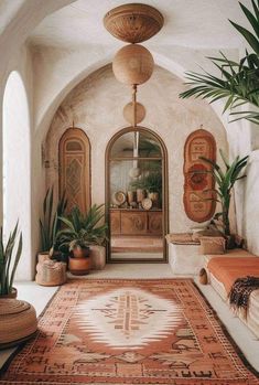 an indoor area with potted plants and rugs