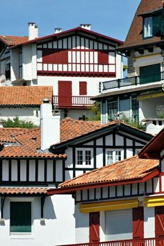 several houses with red and white roof tops