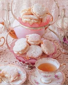 tea and pastries on a pink table cloth