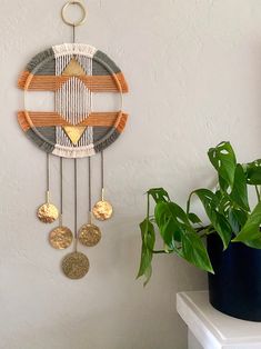 a decorative wall hanging made out of wood and metal