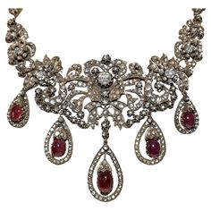 In very good condition. Total weight is 102.4 grams. Totally is diamond about 20 ct. Totally is ruby 28 ct. Total lenght is chain 32 cm. Acid tested to be 8k real gold. Please contact for any questions. Luxury Traditional Rose Cut Diamond Necklace, Ornate Jeweled Necklaces For Formal Occasions, Ornate Rose Cut Diamond Necklace For Formal Occasions, Victorian Jeweled Necklaces For Formal Occasions, Antique Pendant Diamond Necklace With Accents, Antique Diamond Pendant Necklace With Accents, Antique Rose Cut Diamond Necklace For Formal Occasions, Vintage Diamond Necklace With Rose Cut Diamonds, Vintage Diamond Necklace With 17 Jewels For Evening