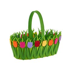 a handbag made out of felt with tulips in the grass on it