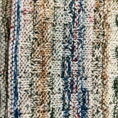 the texture of an upholstered rug is shown in multi - colored yarns